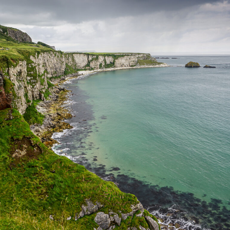 A view of the Irish Sea off the cost of Northern Ireland. The coastline is to the left and the sea is to the right.