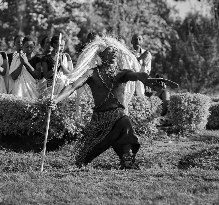 Rwandan dancer prior to the start of the day's mountain gorilla trekking